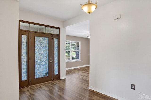 entryway with dark hardwood / wood-style flooring