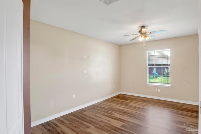 spare room featuring ceiling fan and wood-type flooring