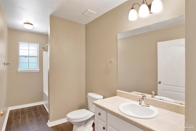 full bathroom with vanity, shower / bath combination, toilet, and hardwood / wood-style floors