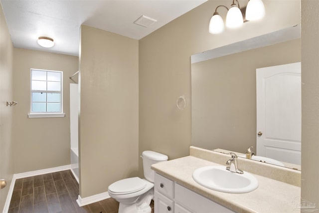 full bathroom with shower / bathing tub combination, vanity, and toilet