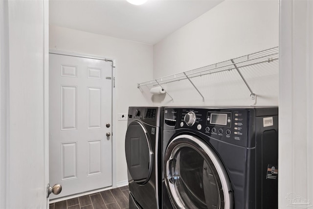 washroom featuring washing machine and clothes dryer