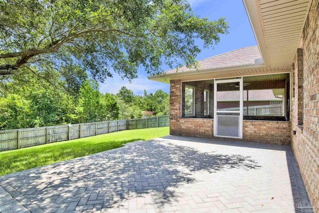 view of patio with a sunroom