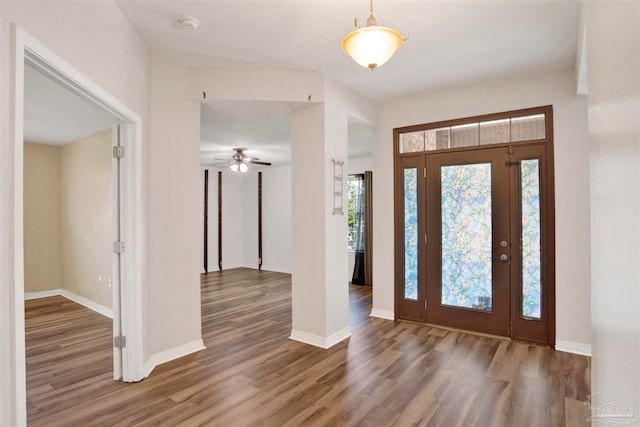 foyer entrance with hardwood / wood-style flooring and ceiling fan