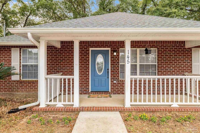 doorway to property with covered porch