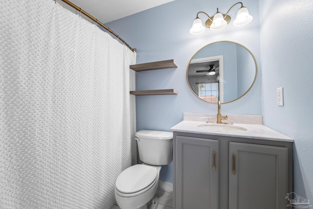 bathroom with vanity, a shower with shower curtain, ceiling fan, and toilet