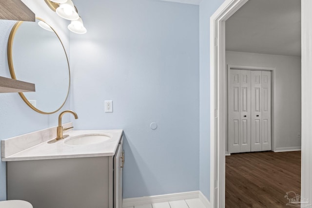 bathroom with vanity and wood-type flooring