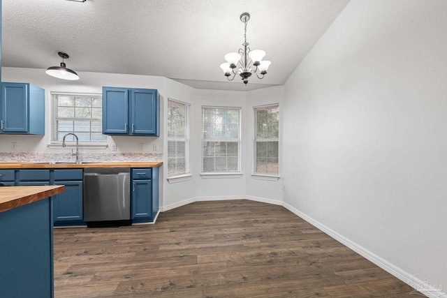 kitchen with blue cabinets, dishwasher, butcher block counters, sink, and hanging light fixtures