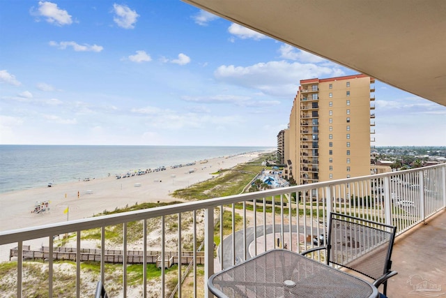 balcony with a beach view and a water view