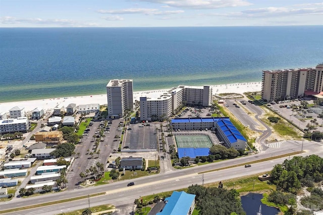 bird's eye view featuring a view of the beach and a water view