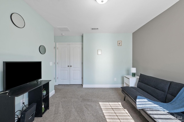 carpeted living room with baseboards and visible vents