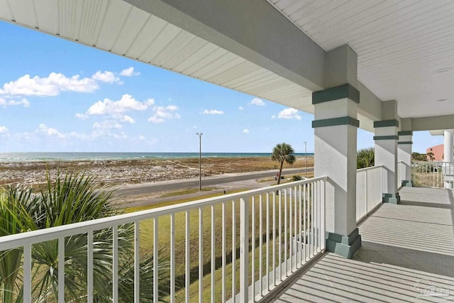 balcony with a beach view and a water view