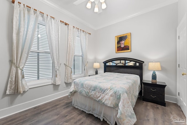 bedroom featuring ornamental molding, a ceiling fan, baseboards, and dark wood-style floors