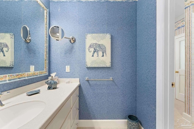 bathroom with vanity and baseboards