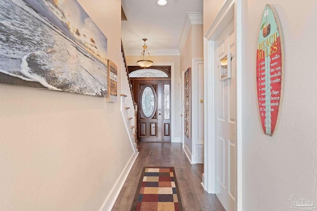 entryway with baseboards, ornamental molding, and dark wood-style flooring