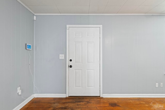 interior space featuring wood finished floors and baseboards