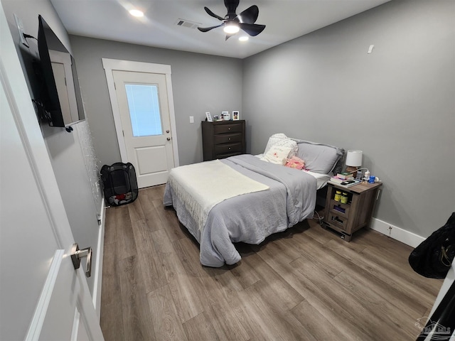 bedroom featuring ceiling fan and light hardwood / wood-style flooring