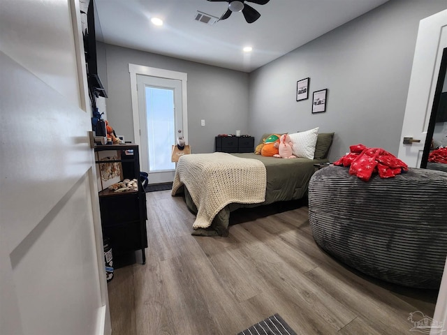 bedroom featuring ceiling fan and hardwood / wood-style flooring