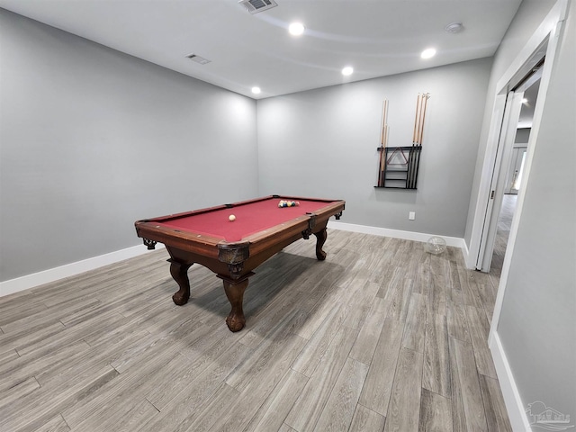 game room with light hardwood / wood-style floors and pool table