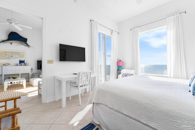 bedroom with ceiling fan and light tile patterned floors