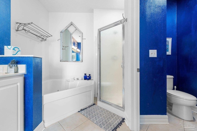 full bathroom with tile patterned floors, vanity, shower with separate bathtub, and a textured ceiling