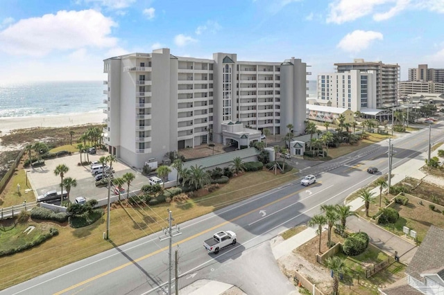 birds eye view of property with a view of the beach and a water view