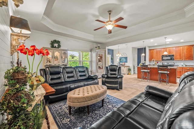 5409 Dalton Cir, Milton, FL 32570 - living area with light tile patterned floors, a tray ceiling, a ceiling fan, and crown molding