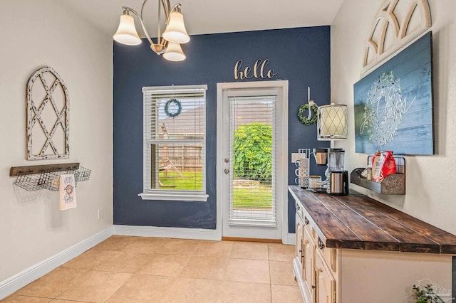 5409 Dalton Cir, Milton, FL 32570 - entryway with light tile patterned flooring and a chandelier