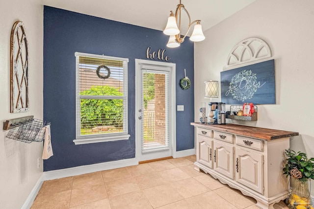 5409 Dalton Cir, Milton, FL 32570 - entryway featuring light tile patterned flooring and a chandelier