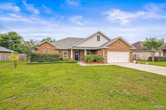 5409 Dalton Cir, Milton, FL 32570 - view of front of property featuring a garage, brick siding, and concrete driveway