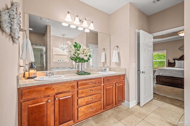 5409 Dalton Cir, Milton, FL 32570 - ensuite bathroom with double vanity, a stall shower, and tile patterned floors