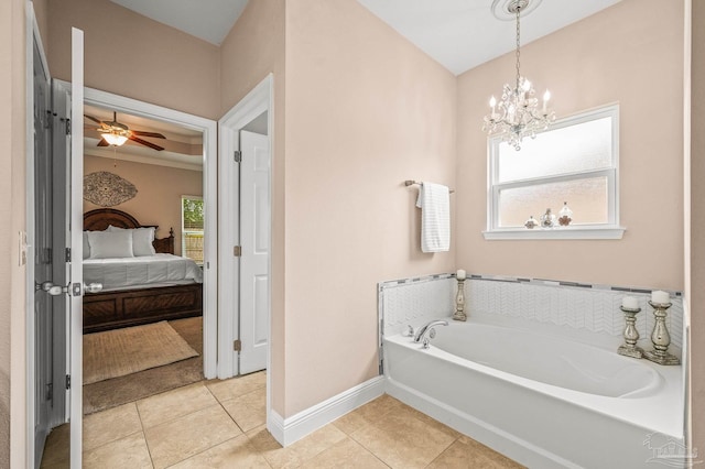 5409 Dalton Cir, Milton, FL 32570 - bathroom with ensuite bath, a garden tub, tile patterned floors, a ceiling fan, and a chandelier