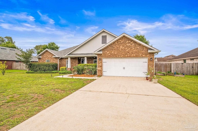 5409 Dalton Cir, Milton, FL 32570 - view of front of house featuring an attached garage, brick siding, and driveway