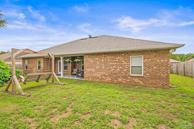 5409 Dalton Cir, Milton, FL 32570 - rear view of property with brick siding, roof with shingles, and a patio area