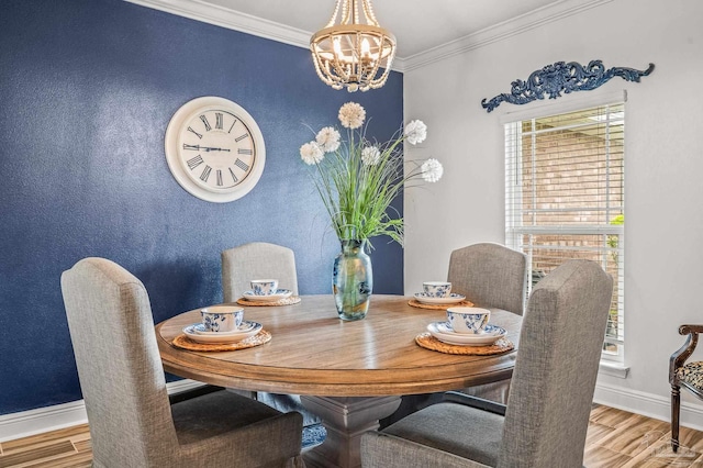5409 Dalton Cir, Milton, FL 32570 - dining space with wood finished floors, healthy amount of natural light, a chandelier, and ornamental molding