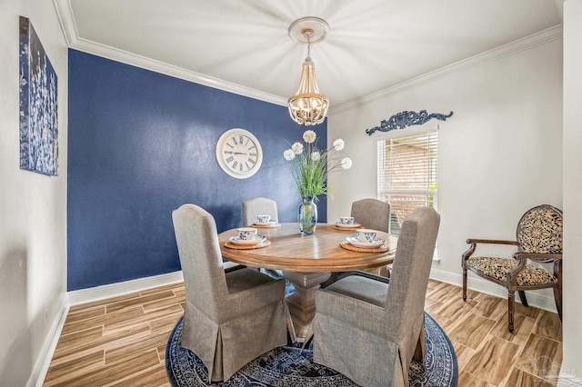 5409 Dalton Cir, Milton, FL 32570 - dining room featuring wood finish floors, a chandelier, and ornamental molding