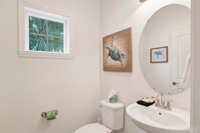 bathroom with toilet and sink