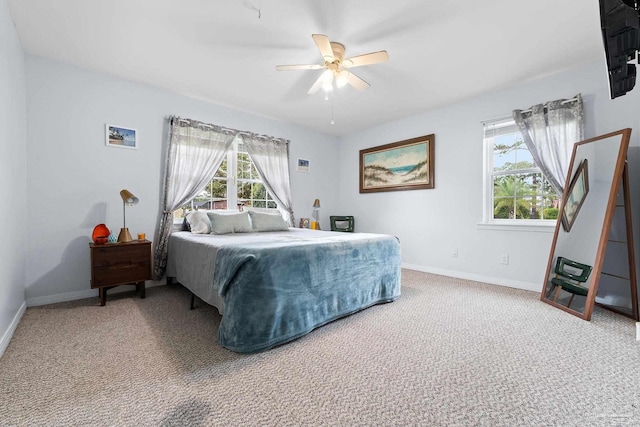 bedroom featuring ceiling fan, baseboards, and carpet flooring