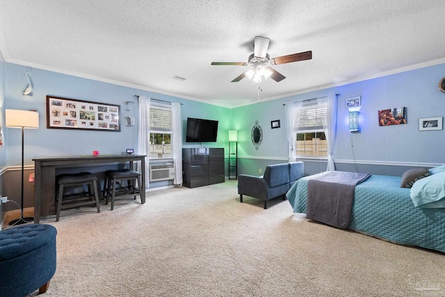 bedroom featuring a ceiling fan, carpet, a textured ceiling, crown molding, and a wall mounted AC