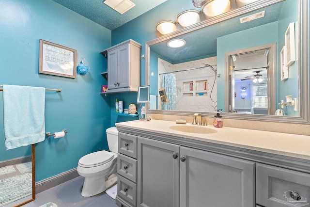 bathroom featuring curtained shower, baseboards, vanity, and toilet