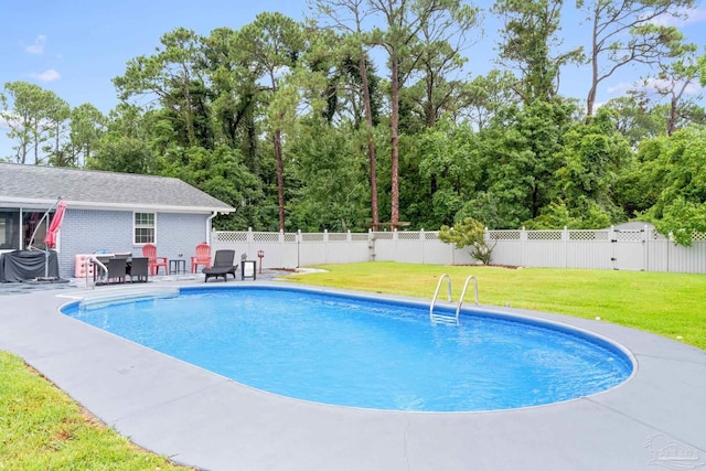 view of pool featuring a fenced backyard, a fenced in pool, a patio, and a yard