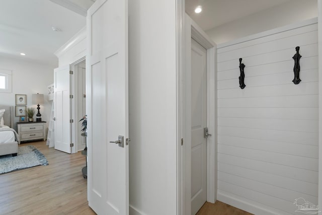 hallway with recessed lighting, baseboards, and light wood-style floors