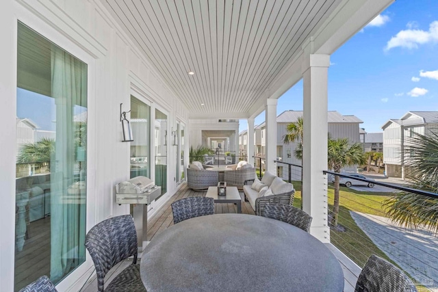 view of patio / terrace featuring outdoor dining area and a balcony