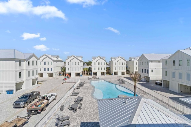 view of swimming pool featuring a residential view