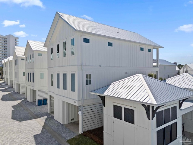 view of home's exterior featuring board and batten siding, metal roof, and a standing seam roof