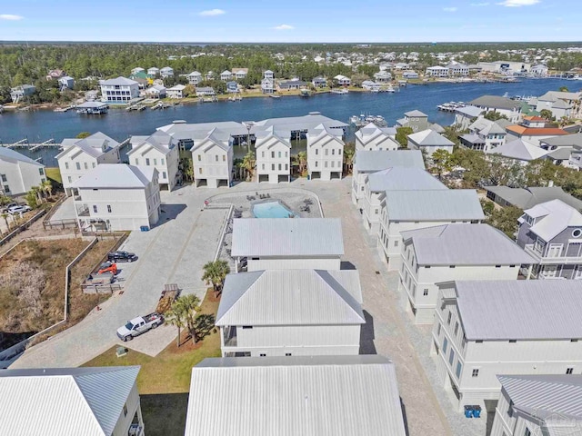 bird's eye view featuring a water view and a residential view