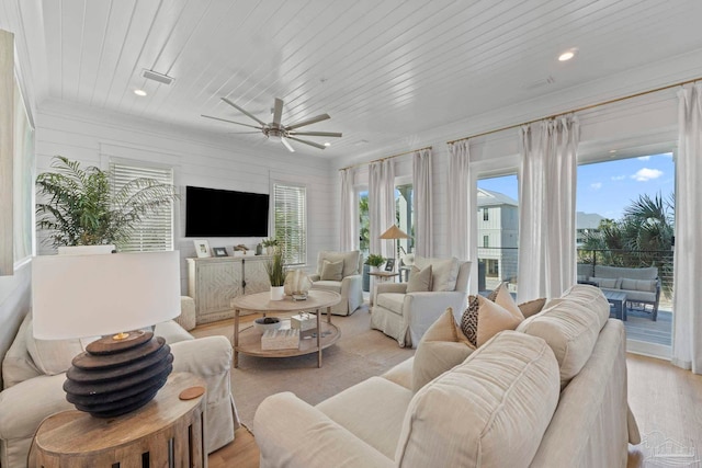 living room with light wood-style flooring, recessed lighting, wood ceiling, and visible vents