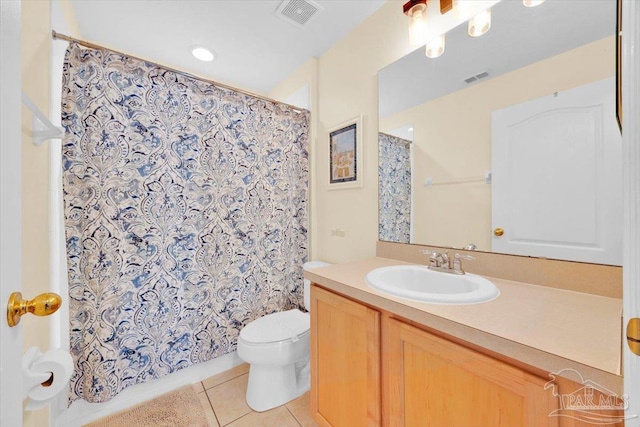 bathroom with vanity, toilet, tile patterned flooring, and a shower with shower curtain