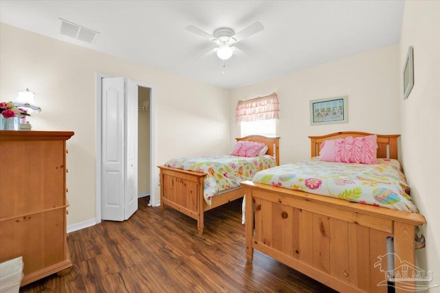 bedroom with ceiling fan and dark hardwood / wood-style floors