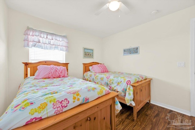 bedroom featuring dark hardwood / wood-style flooring and ceiling fan