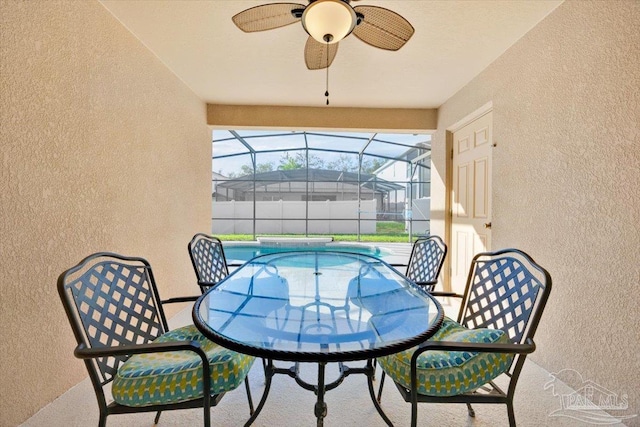 exterior space featuring a swimming pool and ceiling fan